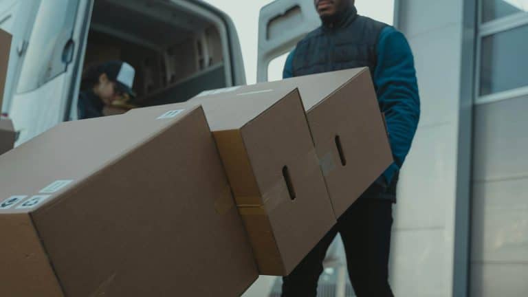 A man safely carrying boxes after completing his Highfield Level 2 Award in Safe Moving and Handling.